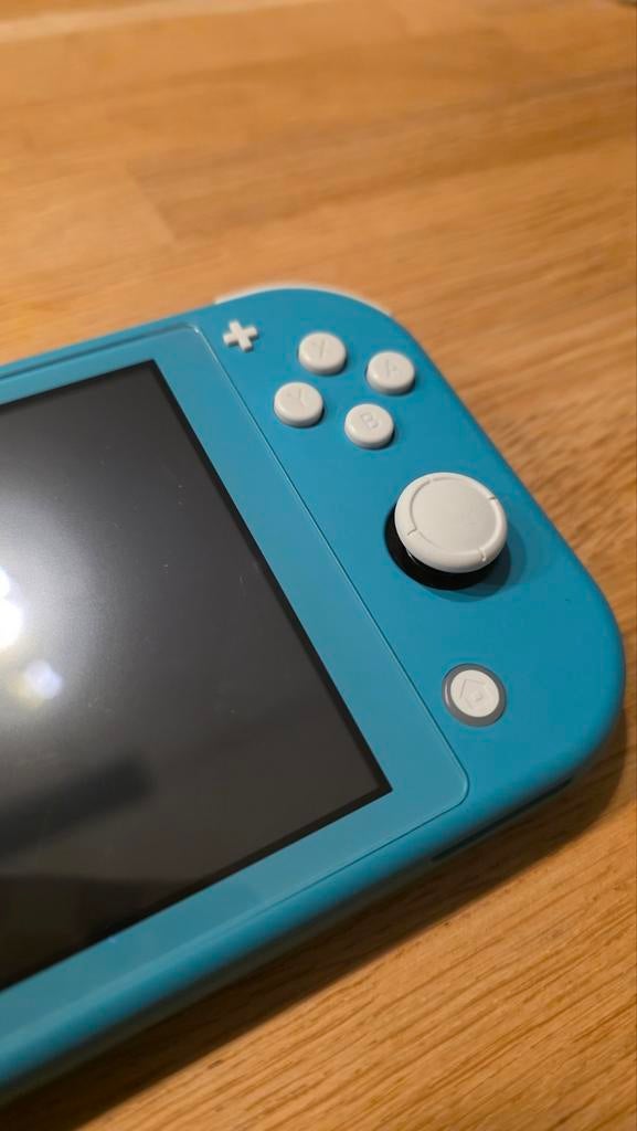 Nintendo switch lite, Spelcomputers en Games, Spelcomputers | Nintendo Switch Lite, Zo goed als nieuw, Turquoise, Met beschermhoes of tas