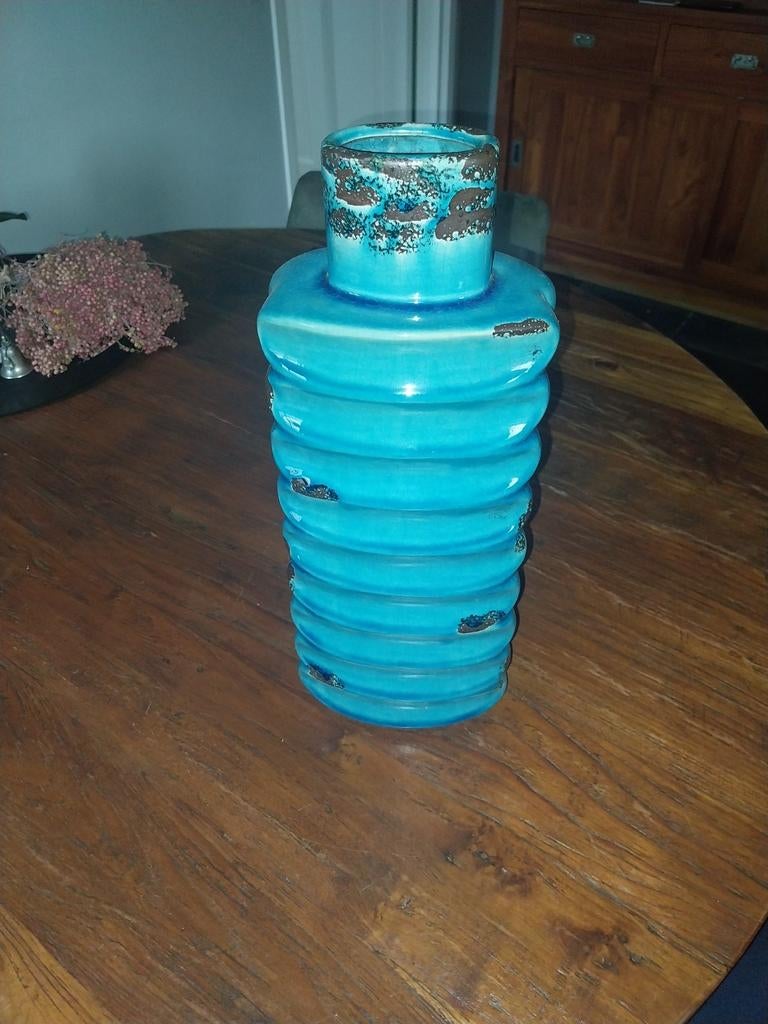 Geglazuurde vaas, Ophalen