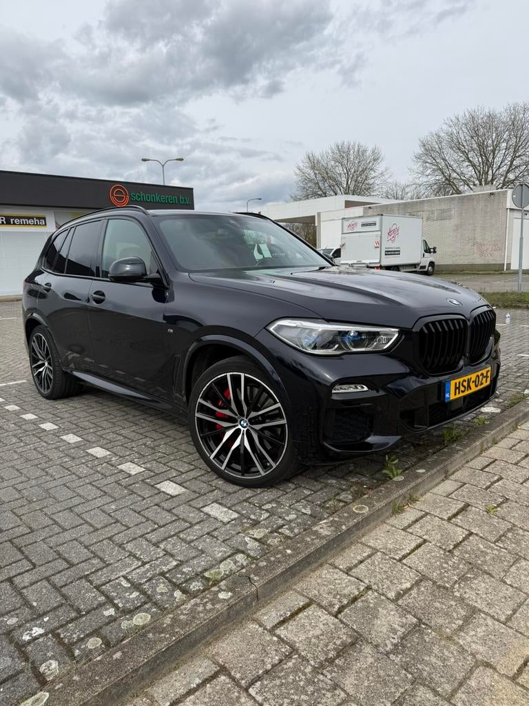 BMW X5 Xdrive45e 394pk Aut 2021 high executive M, Auto's, BMW, X5, Blauw, Vierwielaandrijving, 2998 cc