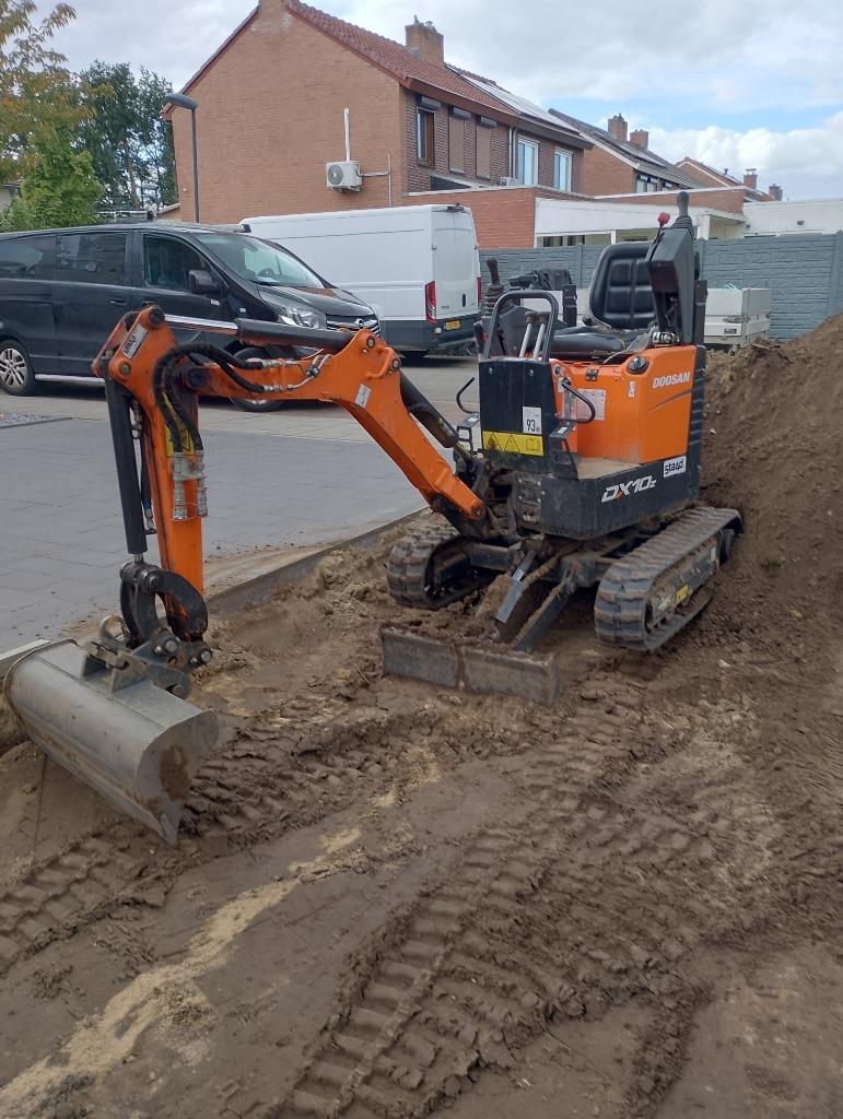 Minigraver met machinist