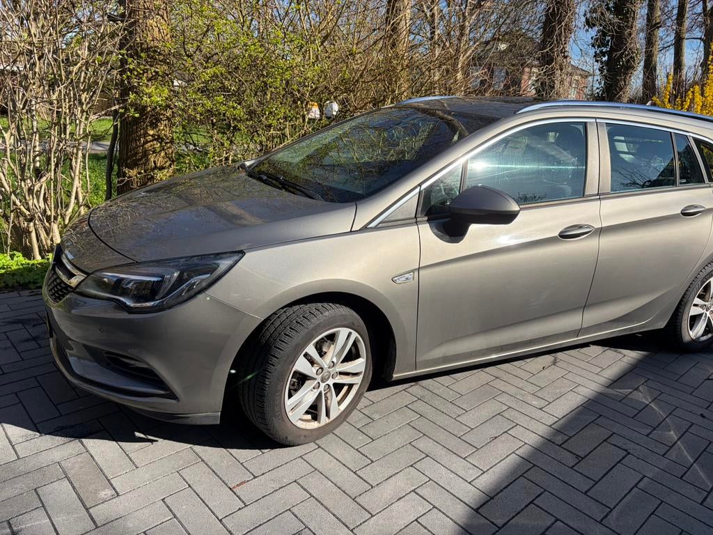Opel Astra 1.0 Turbo 77KW Sports Tourer 2016, Auto's, Voorwielaandrijving, 1178 kg, Bruin, 620 kg