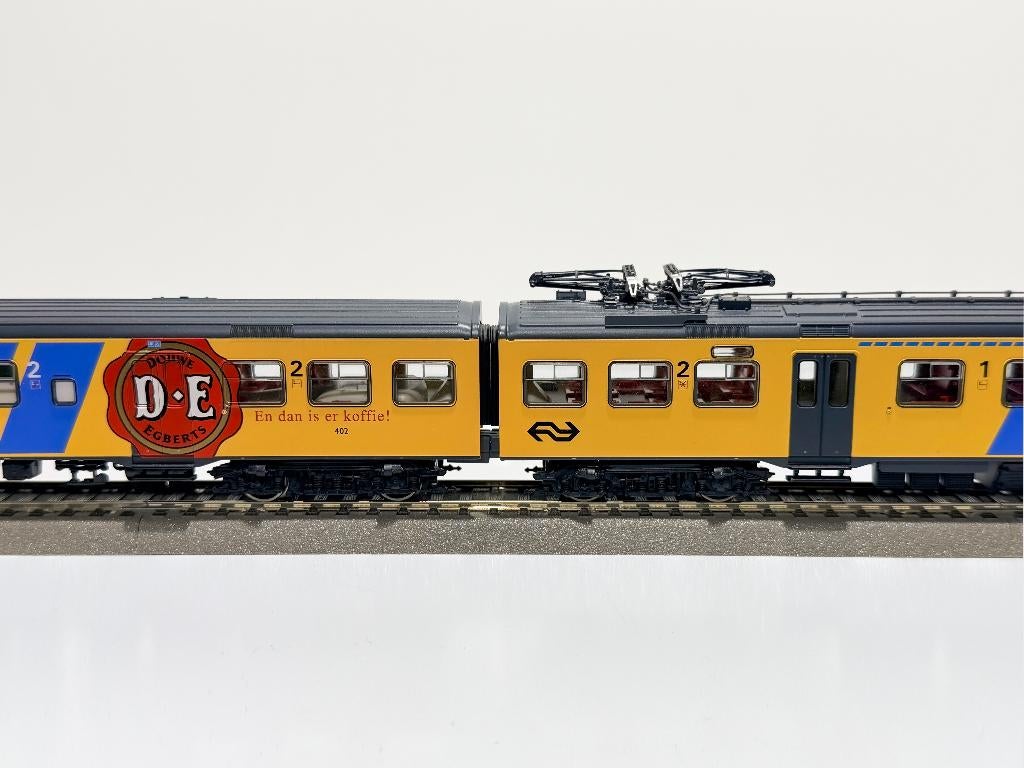 ROCO: 2-delige N.S. Plan V met D.E. Logo **Analoog voor HO**, Ophalen, Gelijkstroom, Analoog, Roco