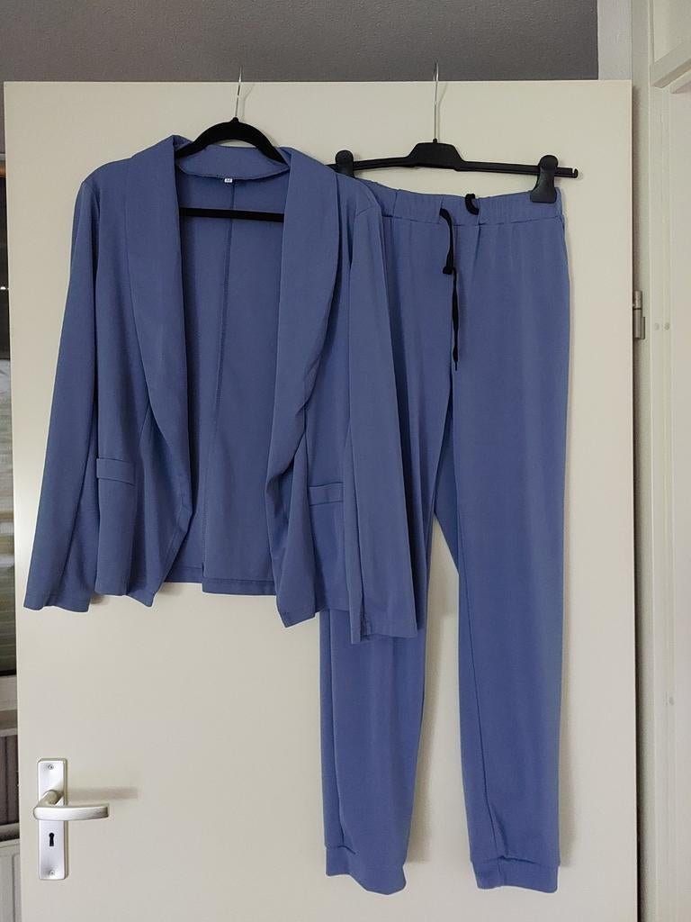 Nieuw travelpak blauw, Ophalen of Verzenden, Zo goed als nieuw, Maat 38/40 (M)