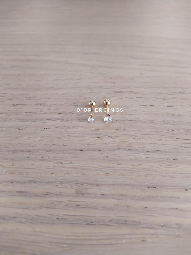 Nieuwe tragus, helix, oorpiercing. Goud. Rond steentje., Sieraden, Tassen en Uiterlijk, Piercings, Ophalen of Verzenden, Zo goed als nieuw