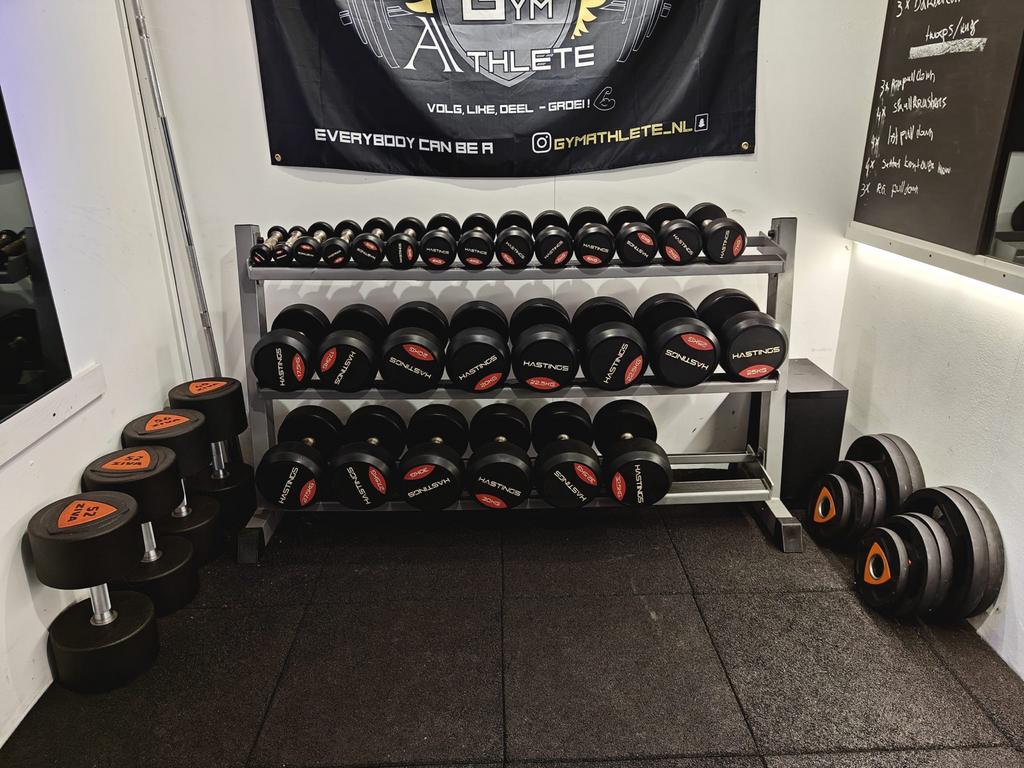 Hastings dumbbellset 1-40 kg incl rekken - nieuwstaat, Sport en Fitness, Fitnessmaterialen, Hastings, Hastings, Ophalen of Verzenden