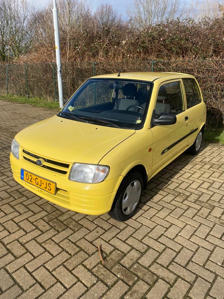 Daihatsu Cuore 1.0 40KW 2000, Auto's, Daihatsu, Particulier, Cuore, Airbags, Android Auto, Apple Carplay, Bluetooth, Navigatiesysteem