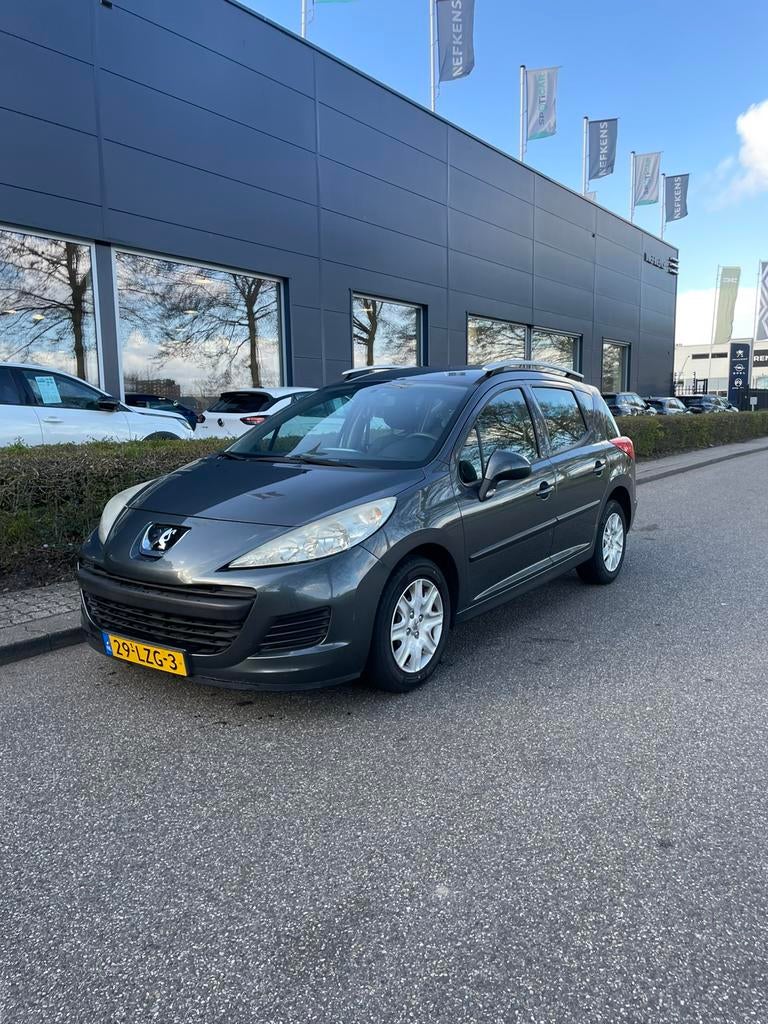 Peugeot 207 1.4 VTI 16V SW 2010 Grijs, Auto's, Voorwielaandrijving, Zwart, Overige bekleding, Origineel Nederlands