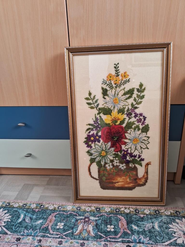 Geborduurde schilderij, Ophalen