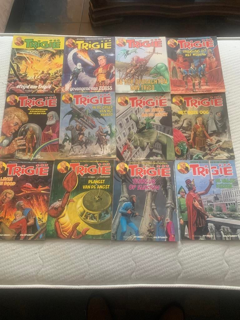 Trigië  22 STRIPS  !! onbeschadigde ruggen van de strips  !!, Meerdere stripboeken, Ophalen of Verzenden, Zo goed als nieuw