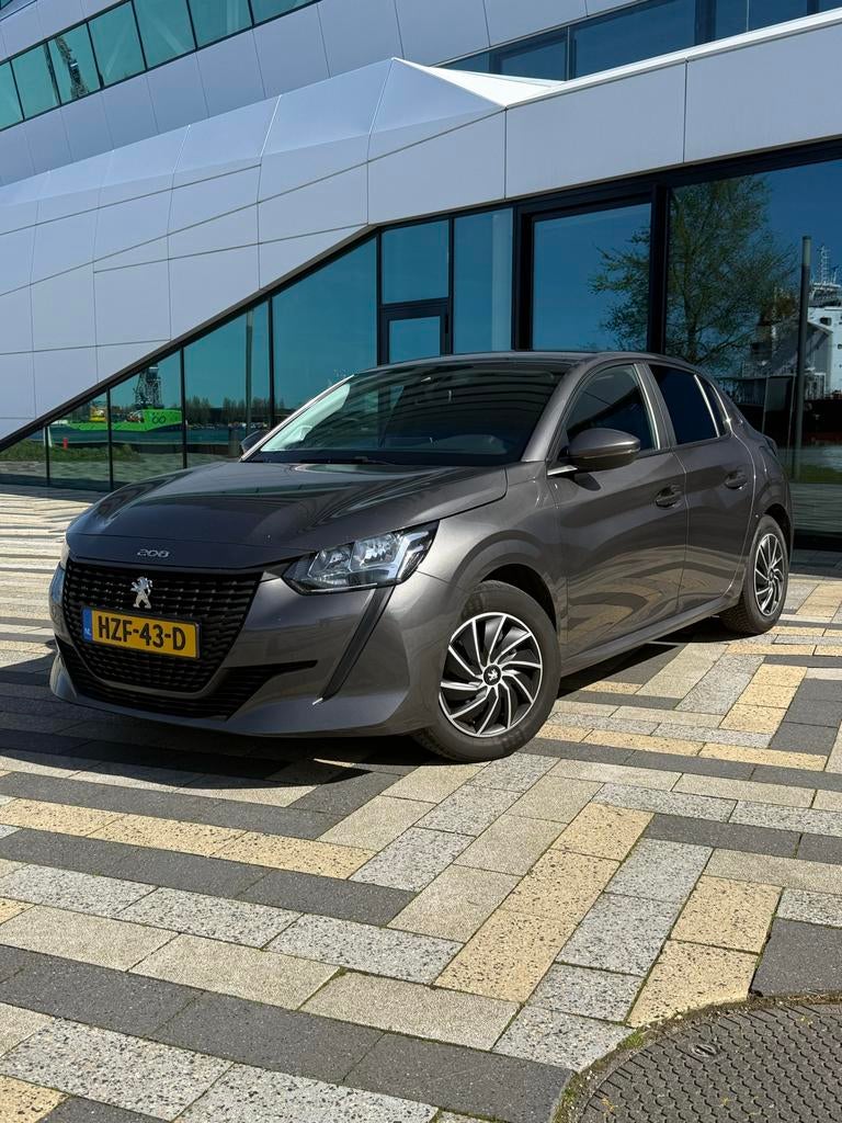 Peugeot 208 1.2 Puretech 75pk 2021 Grijs, Auto's, Peugeot, Particulier, Benzine, Hatchback, Handgeschakeld, Geïmporteerd, Zilver of Grijs
