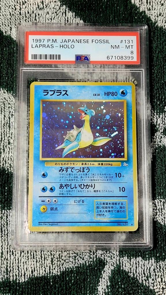 PSA 8 1997 Japanse Fossil Lapras Holo #131 Pokemon Kaart, Ophalen of Verzenden, Zo goed als nieuw, Losse kaart, Foil