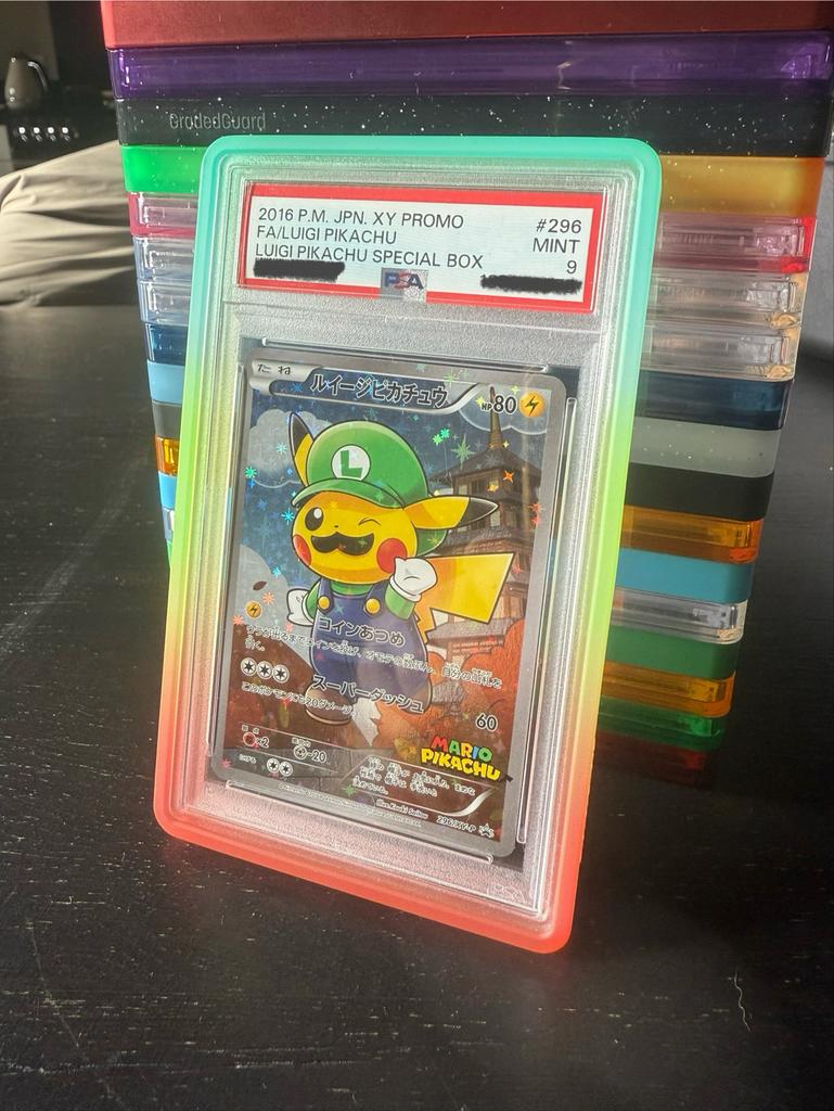 Luigi Pikachu PSA 9 - #296 Poncho, Ophalen of Verzenden, Zo goed als nieuw, Losse kaart, Foil