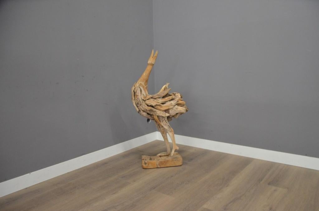 Handgemaakte teak vogel, Ophalen