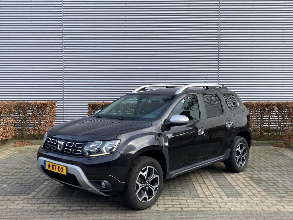 Dacia Duster 1.2 125pk Prestige | Navi | Clima | Camera, Auto's, Dacia, Voorwielaandrijving, 4 cilinders, Duster, Zwart