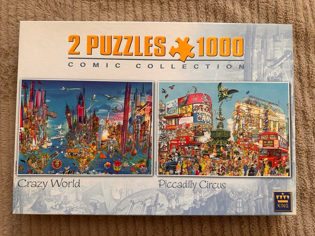 2 King puzzels 1000 stukjes: Crazy World & Piccadilly, Ophalen of Verzenden, 500 t/m 1500 stukjes, Gebruikt, Legpuzzel