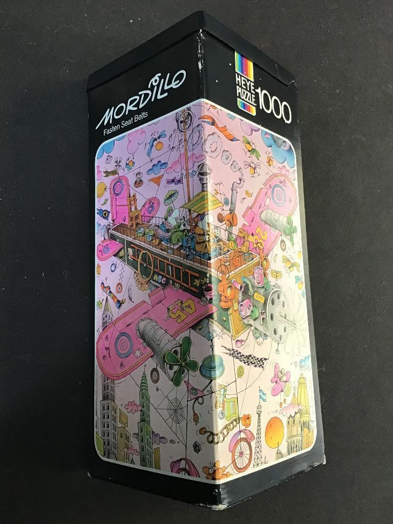 Heye Puzzel Mordillo Fasten Seat Belts 1000 stukjes, Hobby en Vrije tijd, Denksport en Puzzels, Ophalen of Verzenden, 500 t/m 1500 stukjes