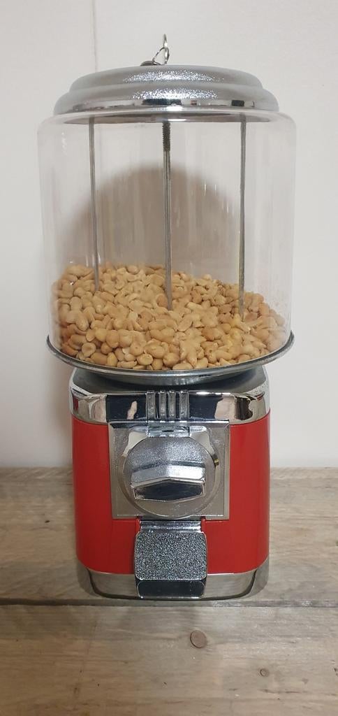 Pinda nootjes automaat, Ophalen