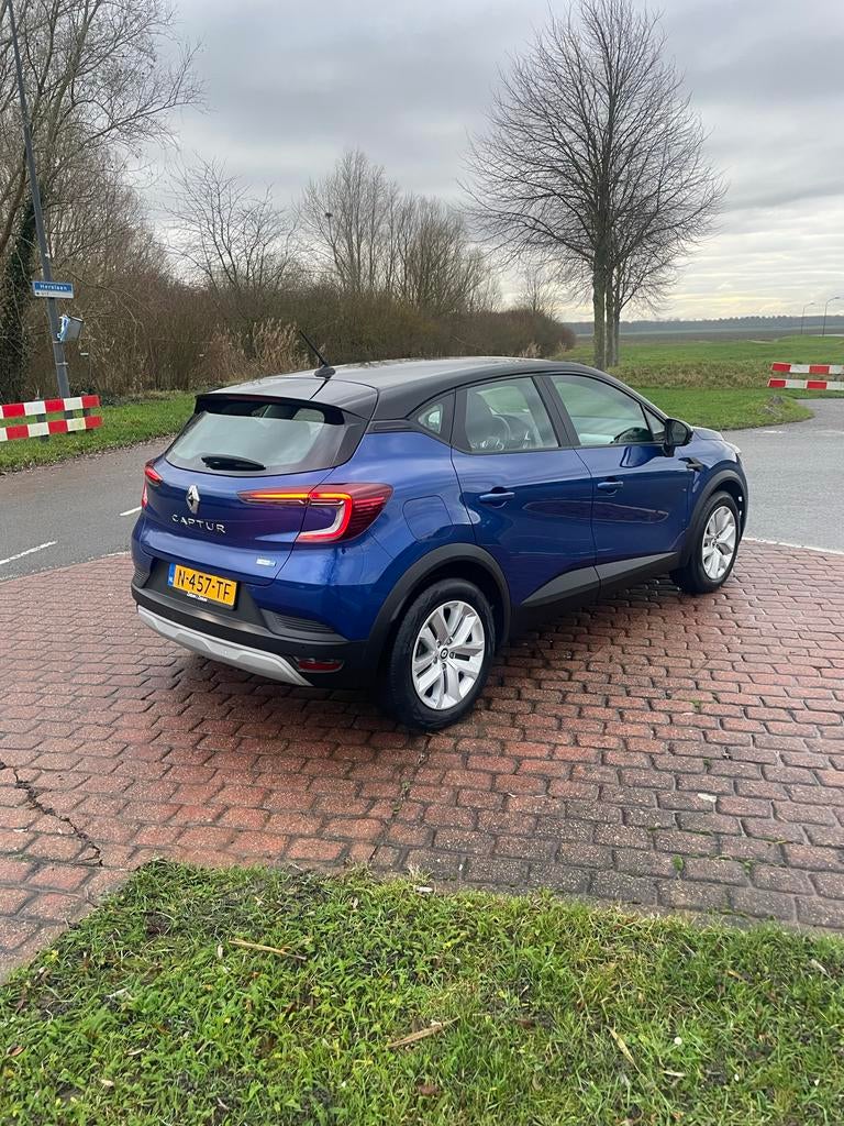 Renault Captur E-tech Hybrid 145pk Aut 2022 Blauw, Auto's, Renault, Stof, 715 kg, Blauw, Origineel Nederlands