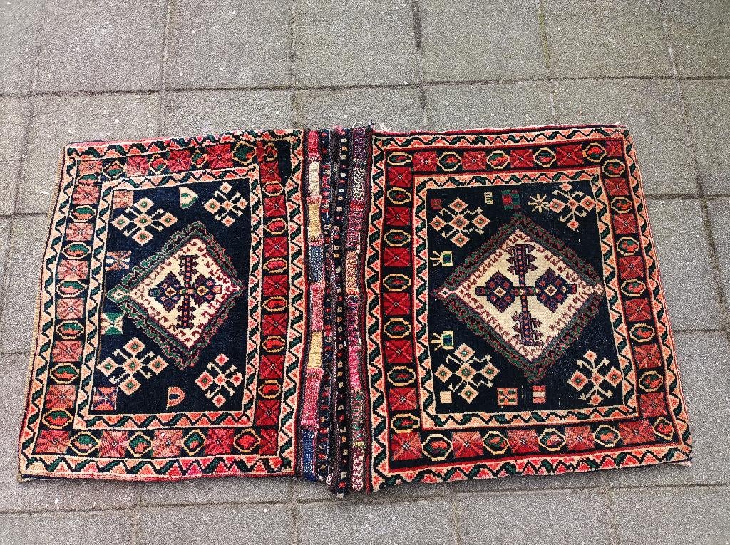 Perzisch tapijt/kamelentas, Ophalen