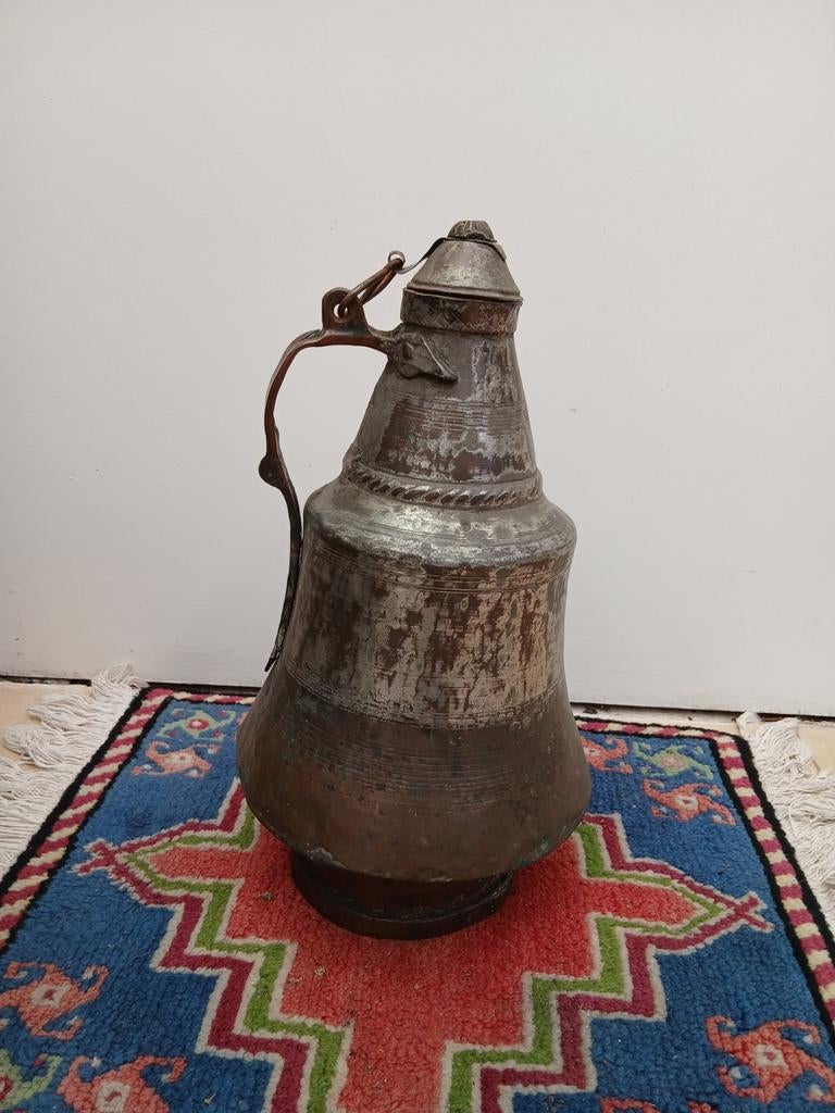 Antieke koperen waterkan, Ophalen