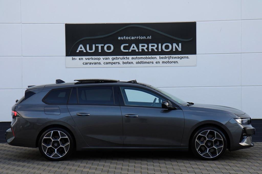 Opel Astra Sports Tourer 1.6 Turbo GS PHEV Pano HUD BTW !, Gebruikt, 4 cilinders, 179 pk, Leder en Stof