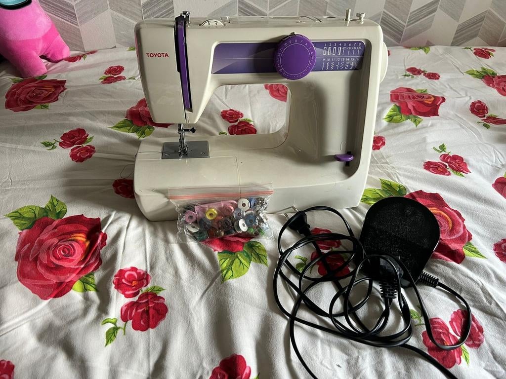 Naaimachine Toyota, Ophalen