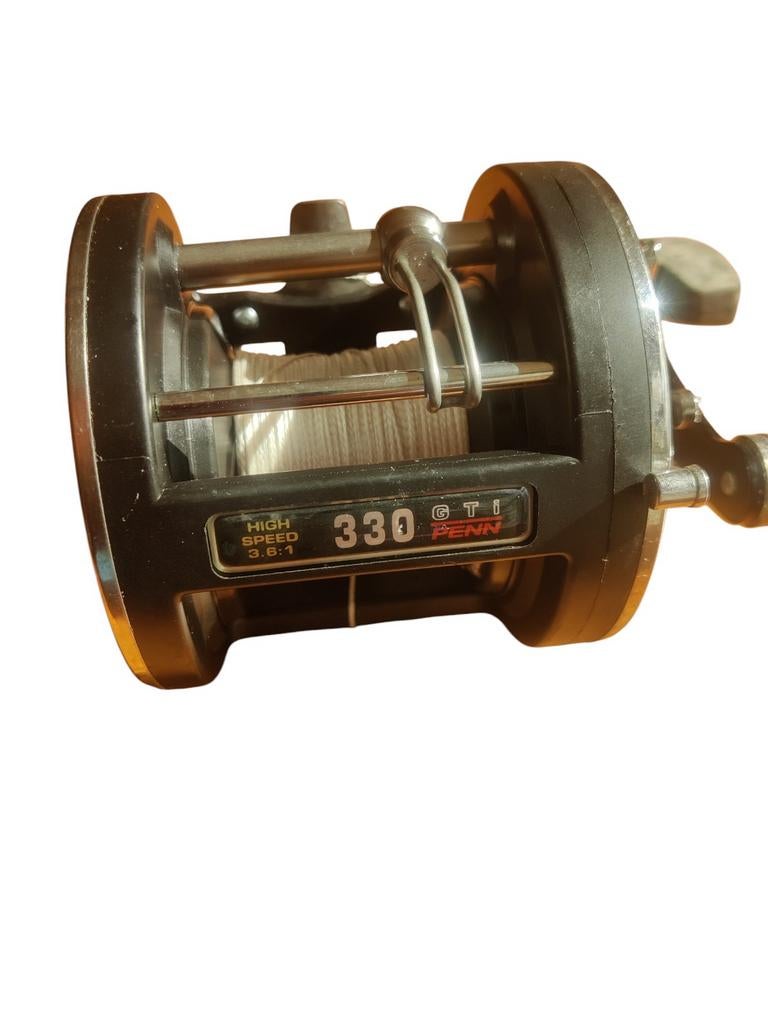 Penn Reels 330GTI  Graphite als nieuw met doos en boekje, Ophalen of Verzenden, Zo goed als nieuw, Molen