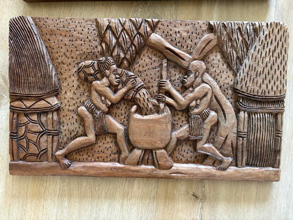 Handgesneden Afrikaanse kunst aan de muur, Ophalen