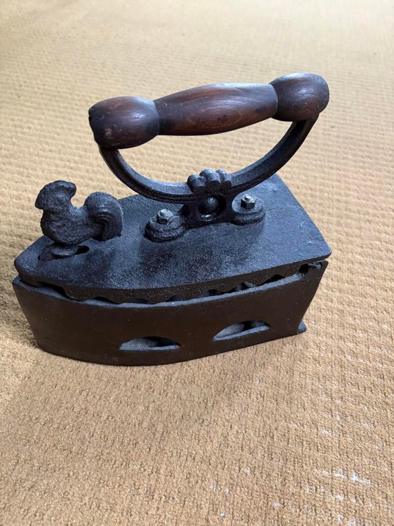 Antiek gietijzeren strijkijzer, Ophalen