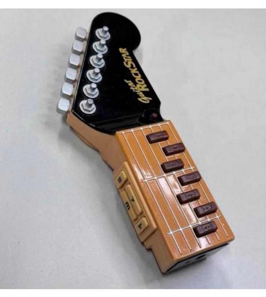Tomy Guitar RockStar - Infra Red Beam Air Gitaar 8 liedjes, Kinderen en Baby's, Speelgoed | Overig, Jongen of Meisje, Ophalen of Verzenden