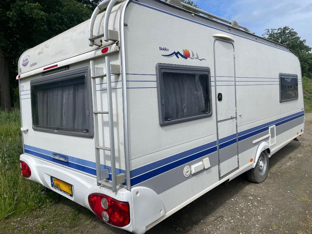 Hobby 560 (2004) - 4/5 persoons caravan, Caravans en Kamperen, Caravans, Particulier, tot en met 5, 1250 - 1500 kg, Rondzit, Hobby