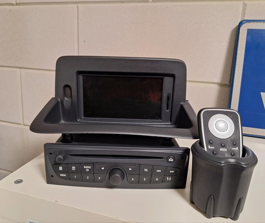 Renault Clio 3 autoradio met TomTom Carminat, Auto diversen, Ophalen of Verzenden