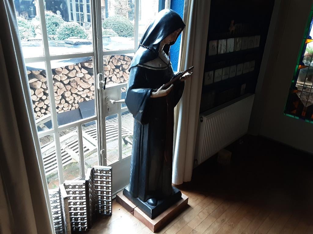 Antiek heiligenbeeld, Ophalen