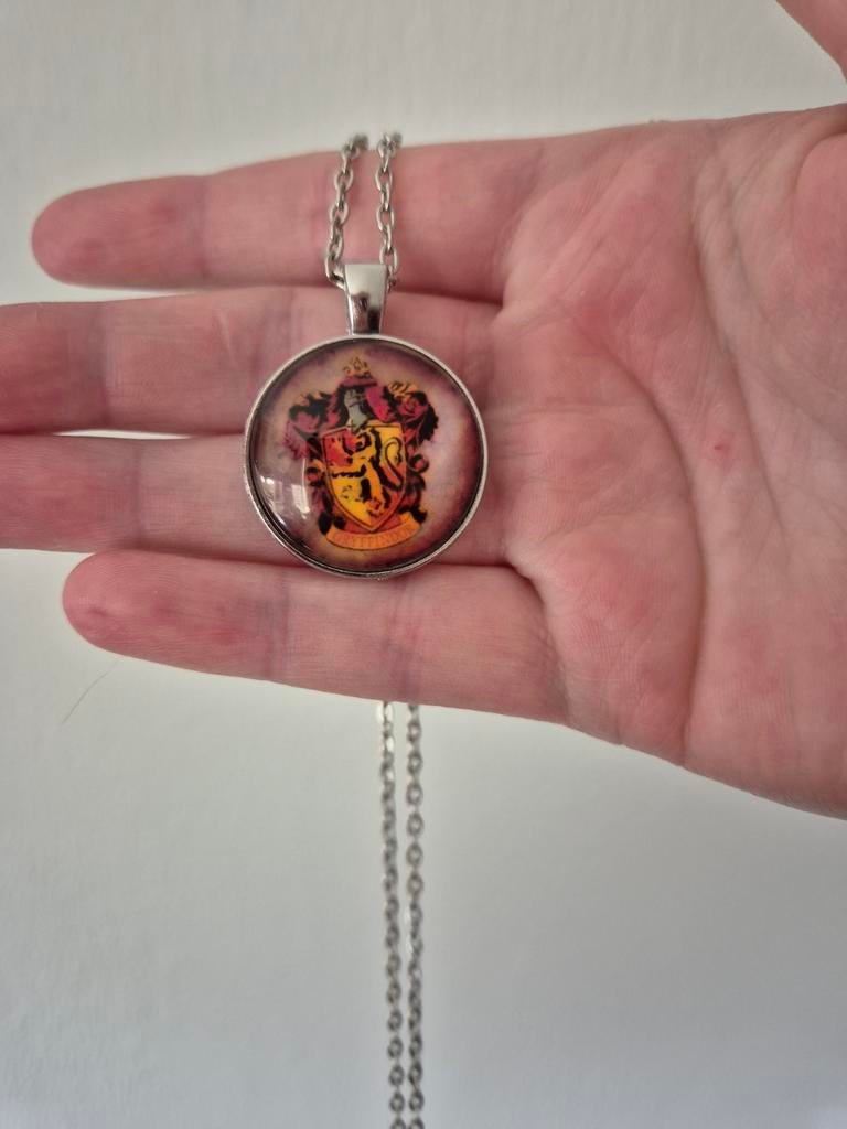 Harry Potter gryffindor ketting nieuw, Ophalen of Verzenden, Nieuw, Zilver, Overige materialen