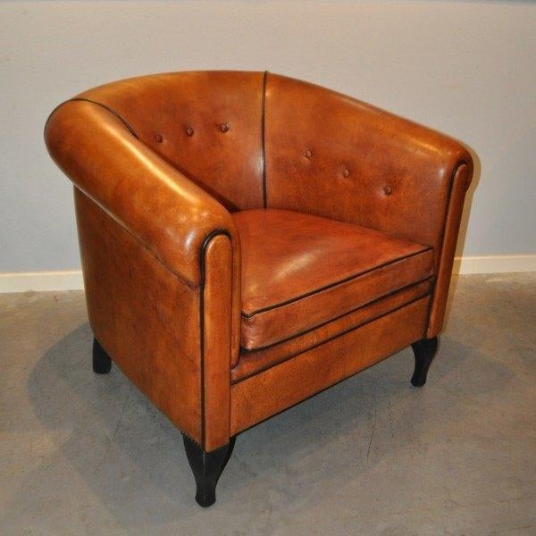 Schapenleren fauteuil staand op mooie gebogen poten., Ophalen of Verzenden, Zo goed als nieuw, 50 tot 75 cm, Leer