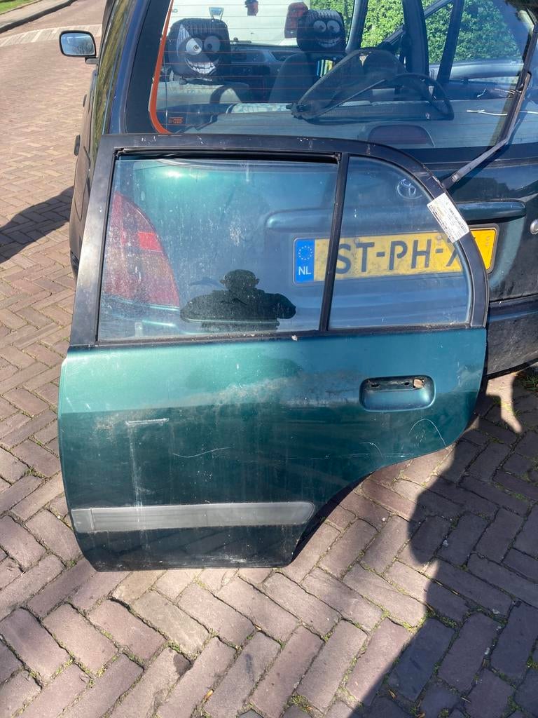 Toyota starlet 5 deurs portier links achter, Ophalen of Verzenden, Achter, Toyota, Deur