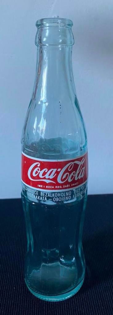 Glazen Coca-Cola flesje. H.23 cm. Uit Servië?, Ophalen of Verzenden, Zo goed als nieuw, Gebruiksvoorwerp