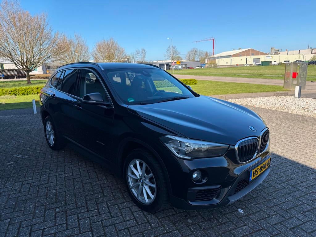 BMW X1 SDrive18d Corporate Lease Essential 2015, Stof, 4 cilinders, 150 pk, Zwart