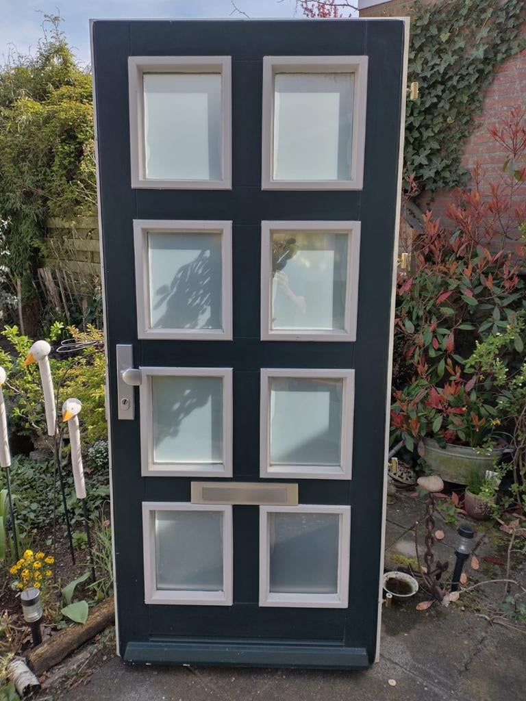 Hardhouten voordeur met dubbelglas, Ophalen