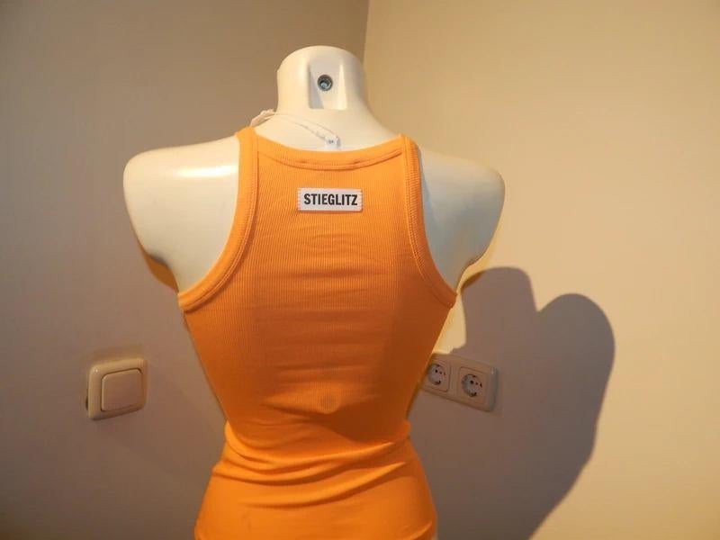 Stieglitz oranje basis top merklabel op de achterkant xs, Kleding | Dames, Tops, Verzenden, Zo goed als nieuw, Zonder mouw, Maat 34 (XS) of kleiner