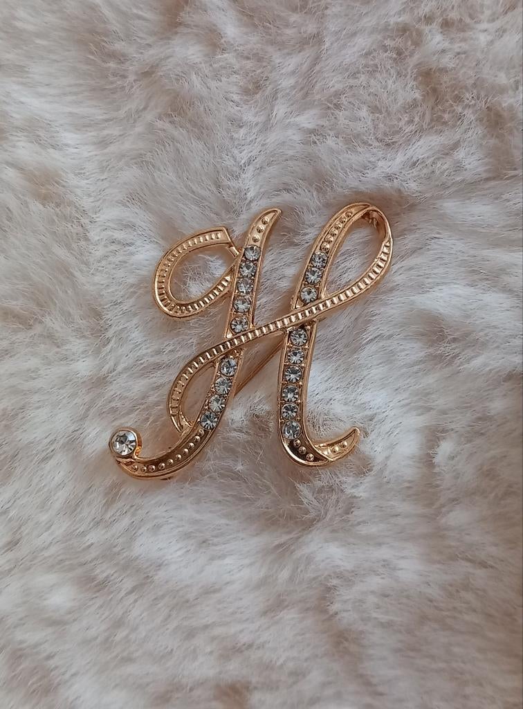 Gouden H broche met steentjes H E R M E S, Overige materialen, 4 tot 7 cm, Nieuw, Ophalen of Verzenden