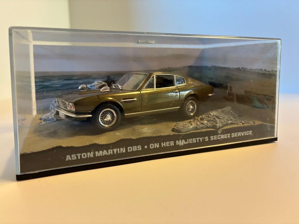 27779: Aston Martin DBS - J.Bond - Majesty's secret service, Hobby en Vrije tijd, Modelauto's | 1:43, Zo goed als nieuw, Auto