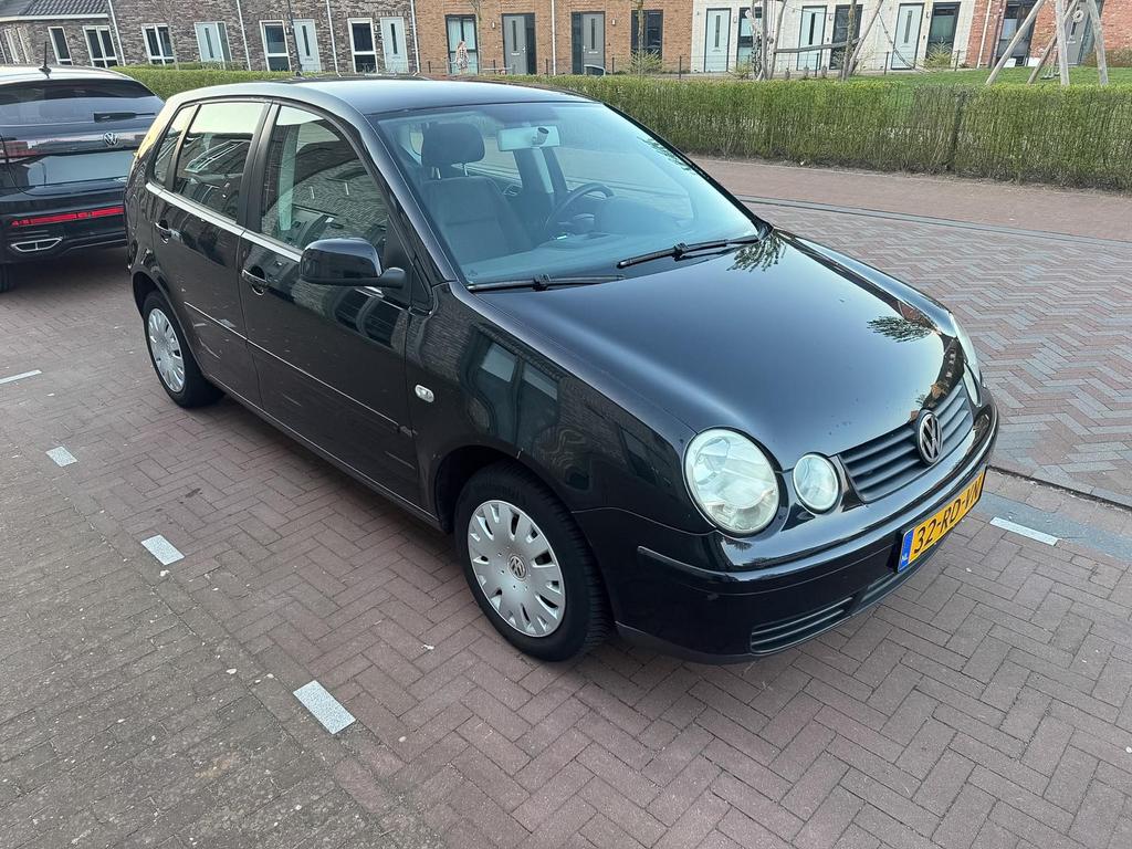 Volkswagen Polo 1.4 2005, Auto's, Voorwielaandrijving, Stof, Zwart, Handgeschakeld