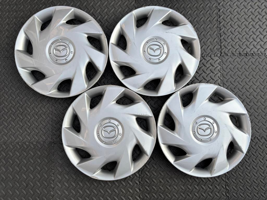 Set originele Mazda 2 en Demio wieldoppen 14 inch, Ophalen of Verzenden, Gebruikt