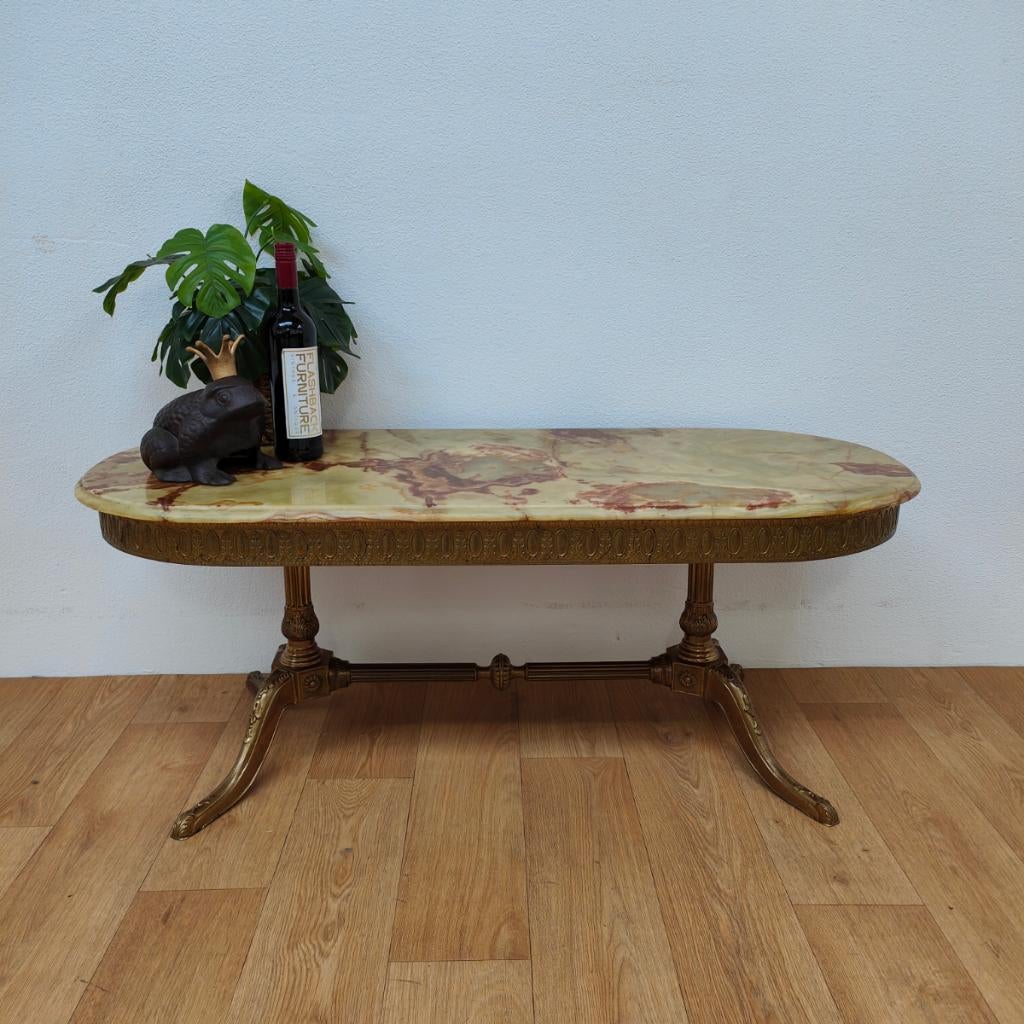 Vintage Regency ovale salontafel. Messing. Marmer onyx blad, Valkenswaard, Gebruikt, 100 tot 150 cm, Info@flashbackfurniture.nl