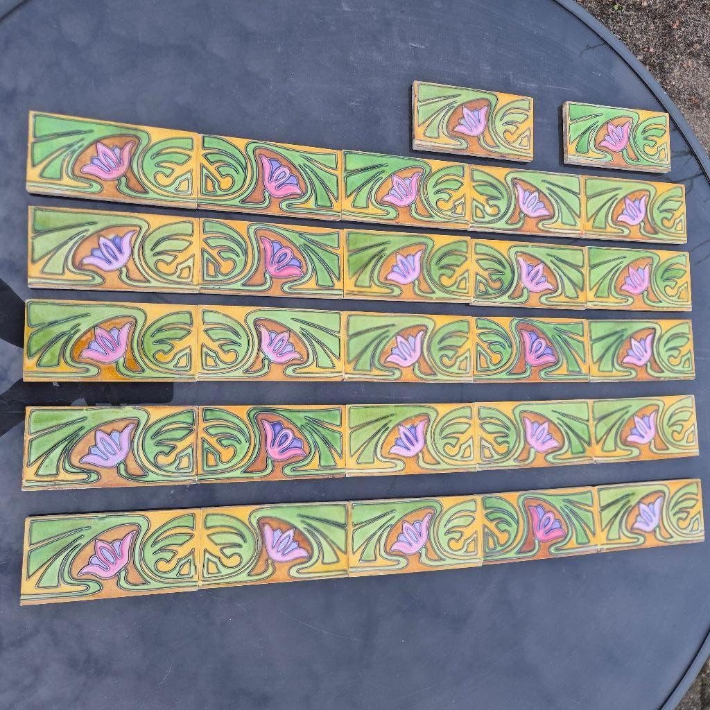 27 antieke randtegels met decor in relief, Ophalen