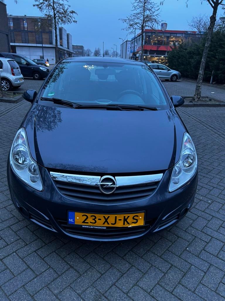 Opel Corsa 1.4 16V 5D 2007 blauw, Voorwielaandrijving, 1063 kg, Zwart, 4 cilinders