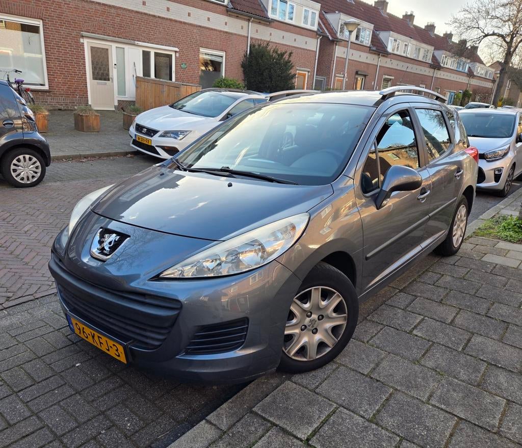 Peugeot 207 1.4 95pk 2009 Grijs, Auto's, Voorwielaandrijving, Stof, Origineel Nederlands, Stationwagon