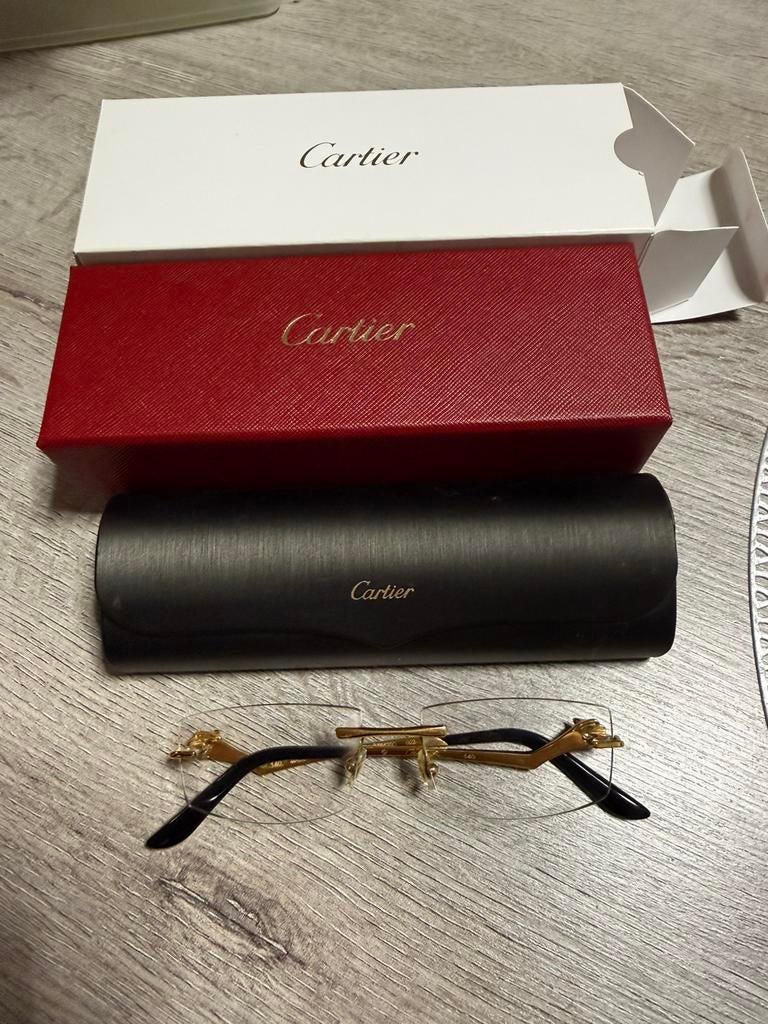 Cartier CT0120O-001 ( panter ) + factuur, Ophalen, Zo goed als nieuw, Bril, Overige merken
