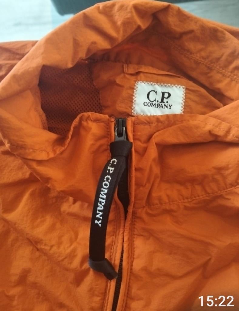 C.P. Company Crincle windjack I 185€vaste pr(nieuw ca 500€), Ophalen, Nieuw, Maat 52/54 (L), Oranje
